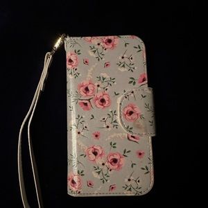Beautiful iPhone 14 Pro wallet case. Light blue with flowers. Magnetic closure.